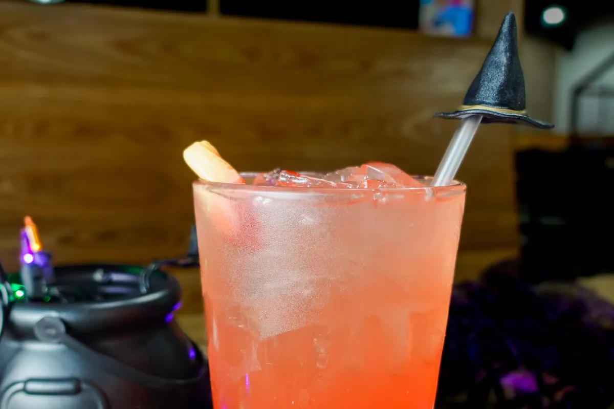 City Eats Mai Tai cocktail with Bacardi Rum, Lime Juice, Grand Mariner, Amaretto, topped with a Myers reserve dark rum float, garnished with a lime wedge, cherry, and mint leaf.
