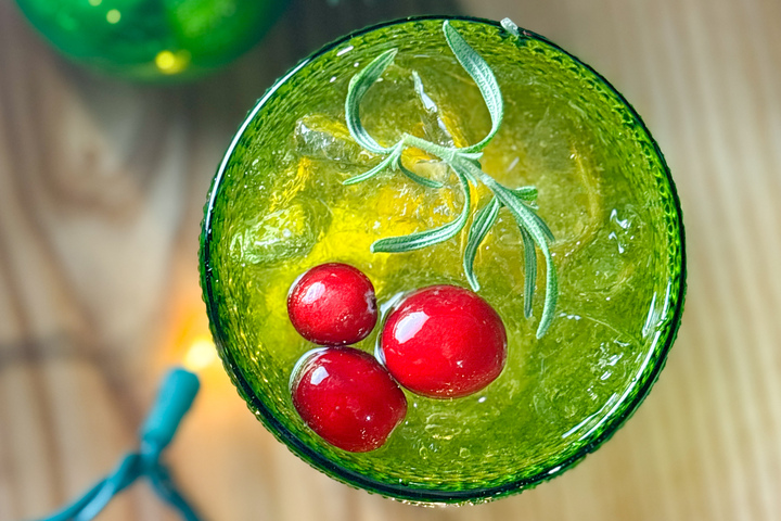 City Eats Strawberry Lemonade Slushie with Absolut Citron, lemonade, strawberry puree, blended and garnished with a lemon wedge.