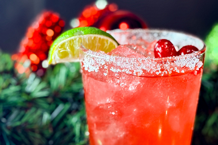 City Eats Blackberry Arnold Palmer cocktail with Crown Royal Blackberry, lemonade, unsweetened tea, garnished with a lemon.