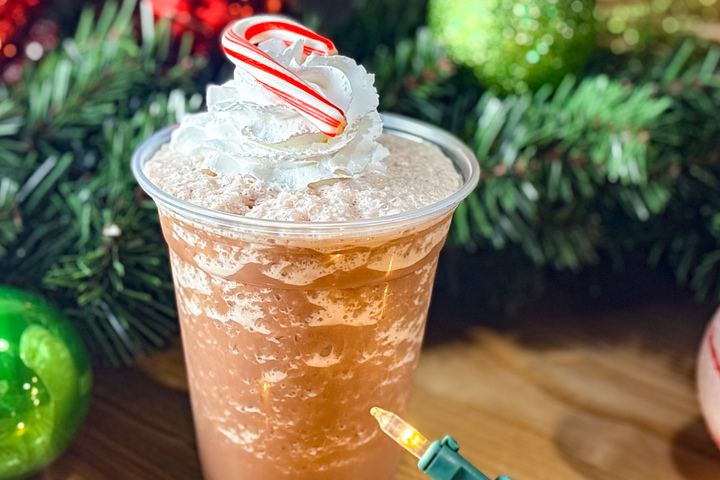 City Eats Rocket Pop cocktail with Twisted Tea, Blue Curacao, and grenadine topped with a Bomb Pop.