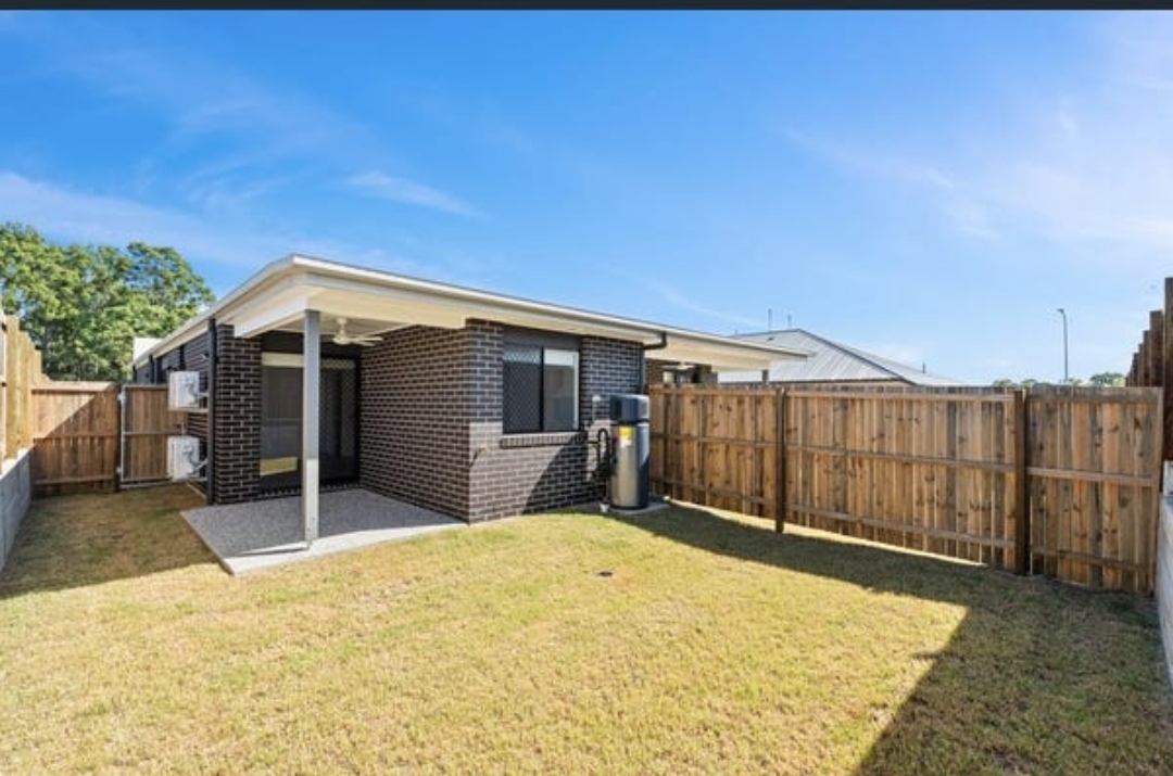 Concrete courtyard at a rental property suitable for a compact aquaponics system