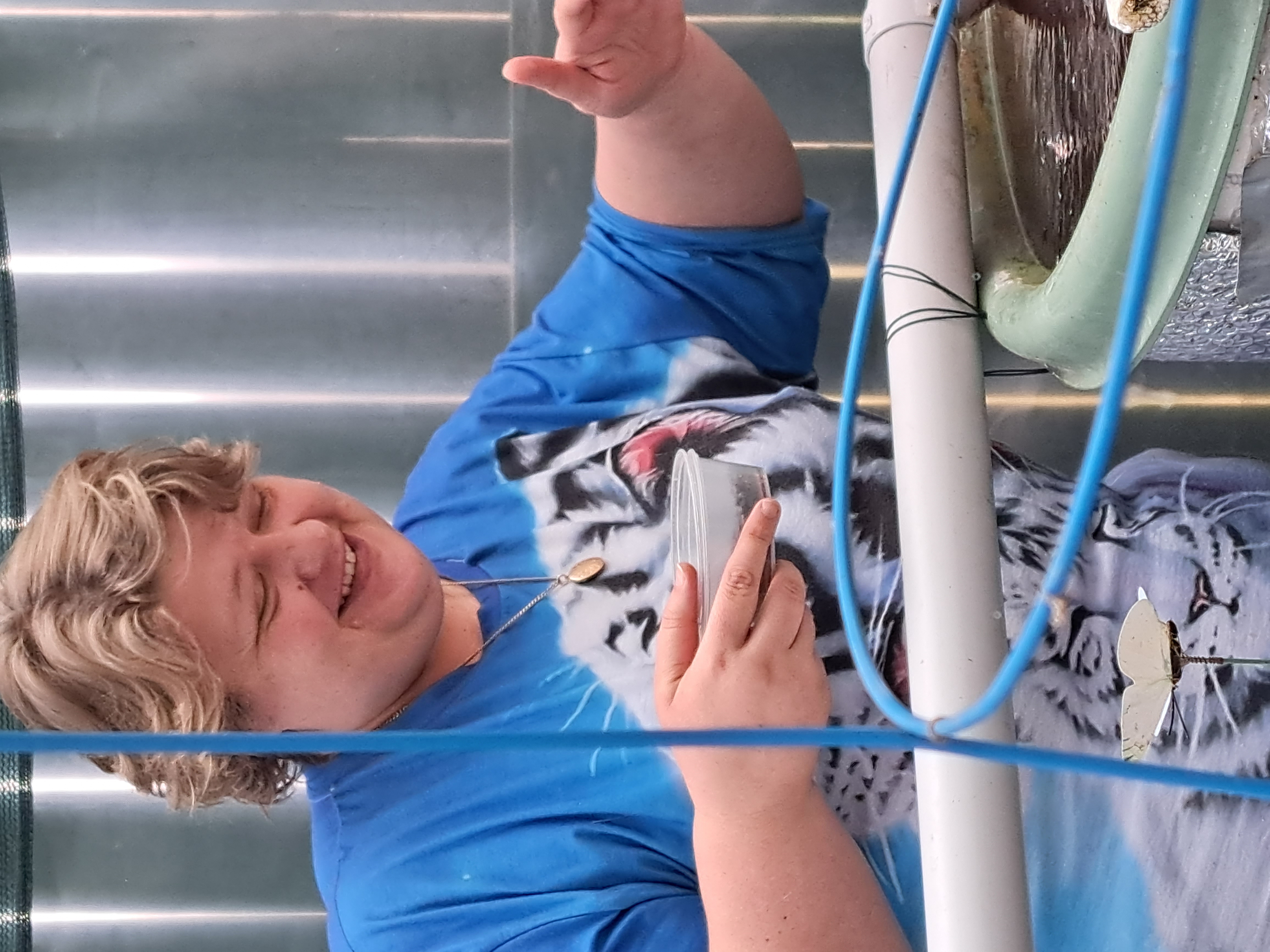 Candy working on a backyard aquaponics system after years of practical experience