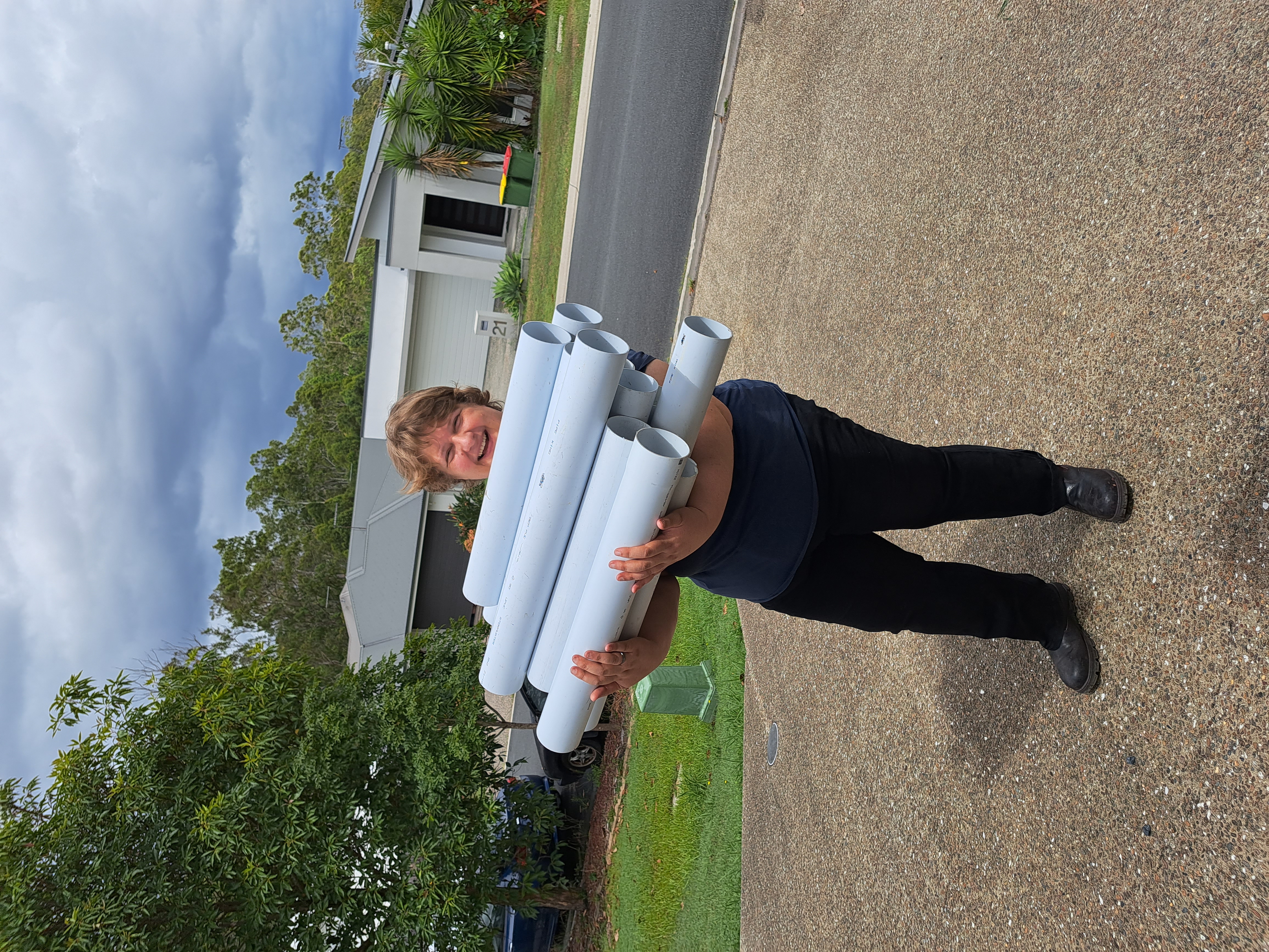 Candy collecting recycled PVC pipe to build a backyard aquaponics system.