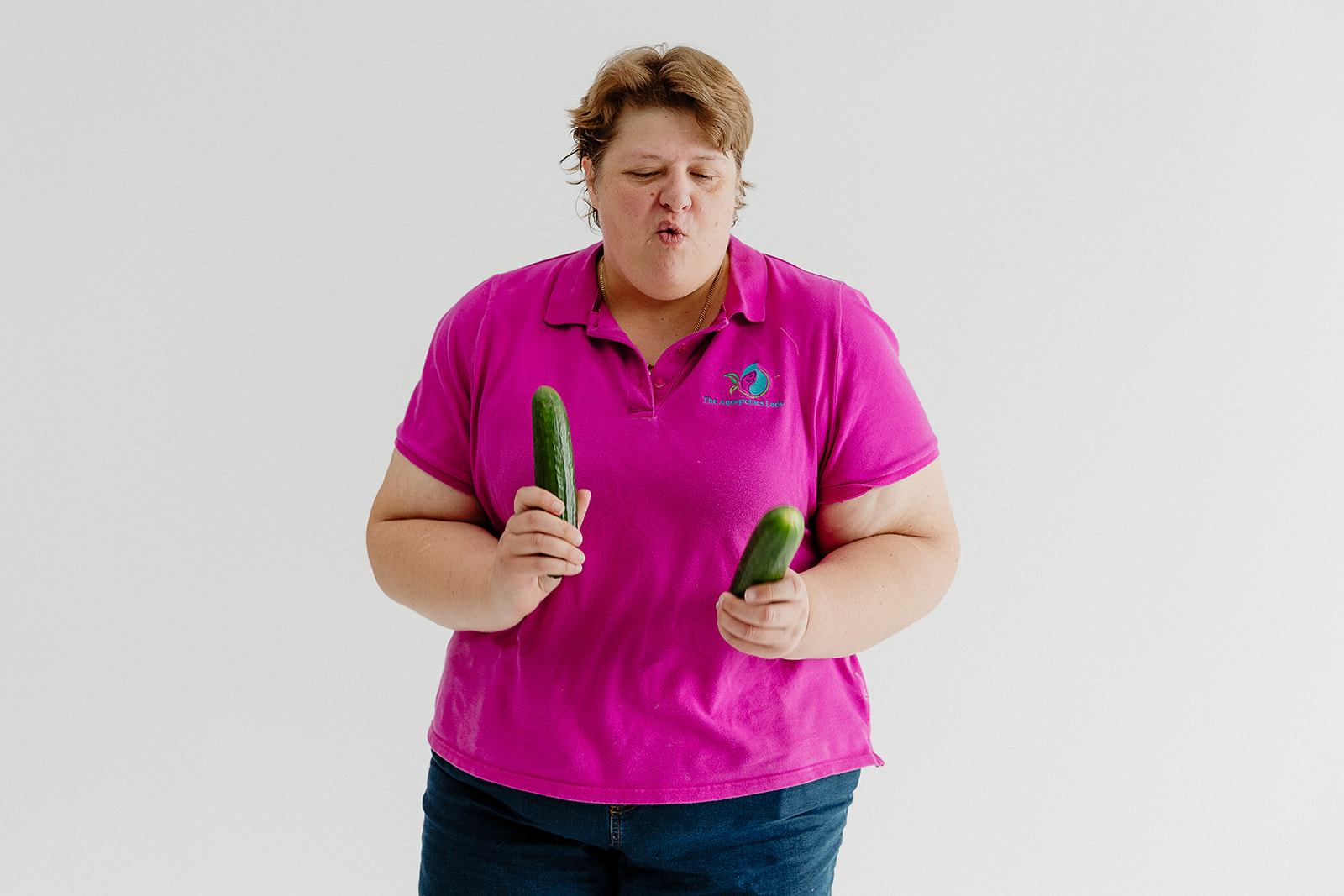 Candy Alexander having fun with homegrown cucumbers