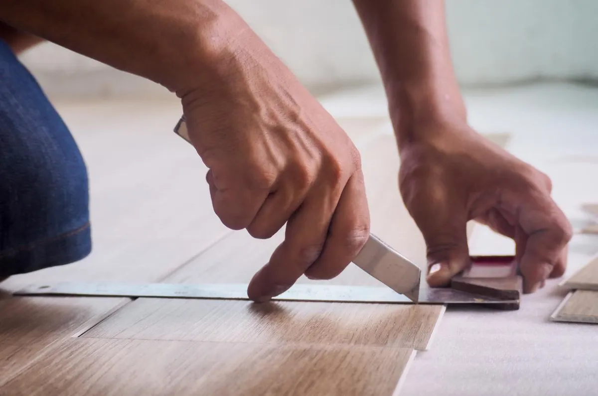 Professional installer fitting luxury vinyl flooring