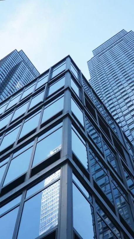 Tall skyscraper building representing Floorable’s growth and strong foundation
