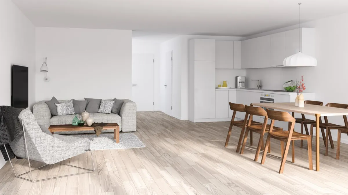 Spacious room with clean vinyl plank flooring in bright, modern interior