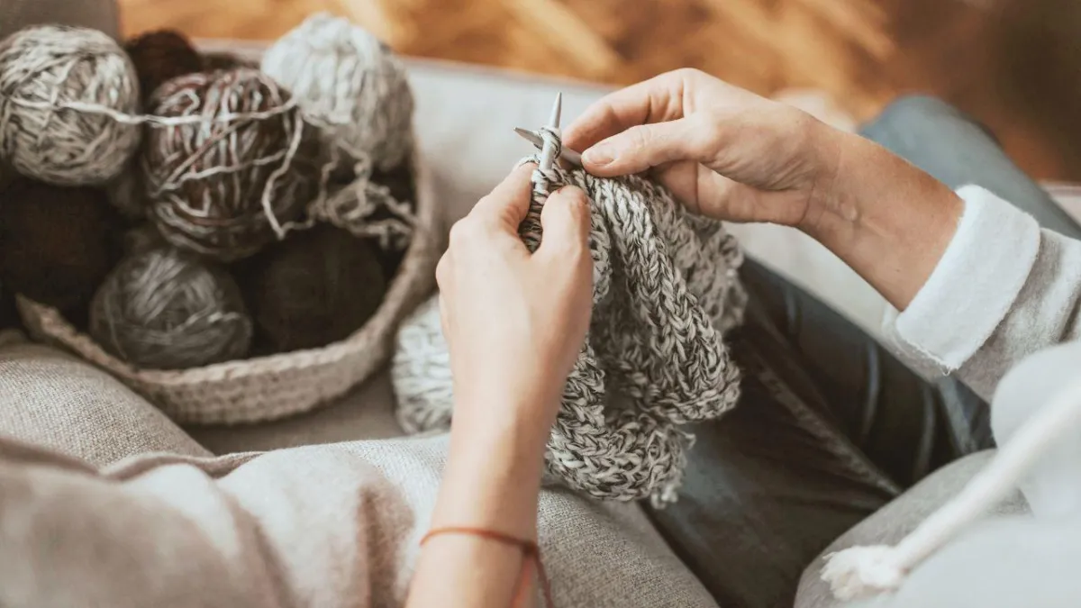 Calming and mindful neutral toned yarn yarn and hands knitting