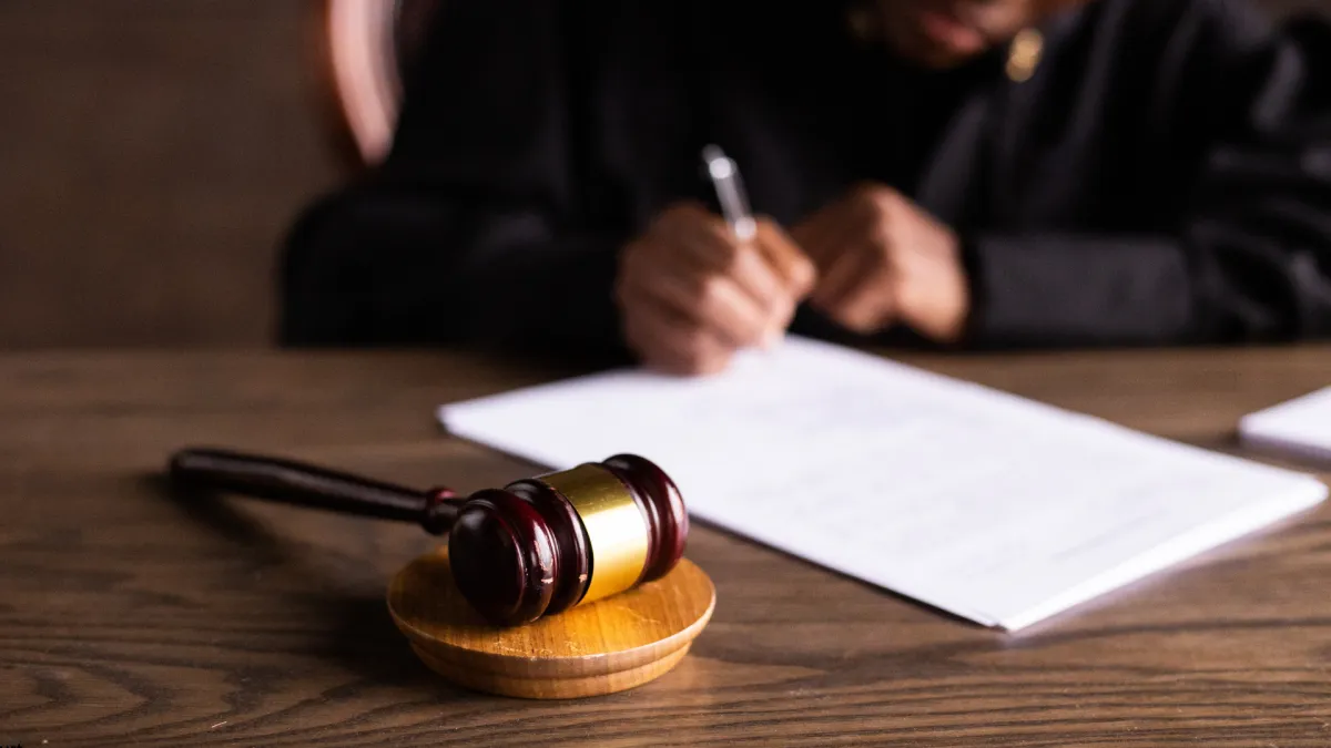 Worried parent contemplating during a DCF case discussion