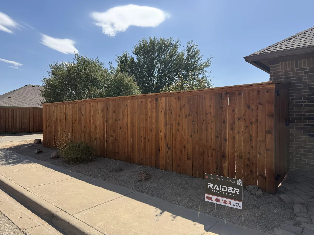 Wood fence along driveway in Lubbock, TX built by Raider Fence & Stain