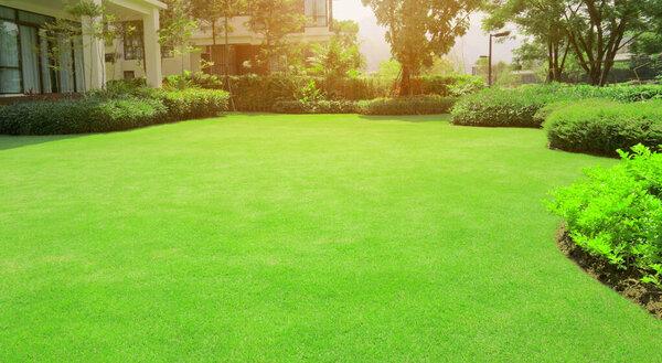 Freshly mowed front yard with bright green grass in Minooka, IL.
