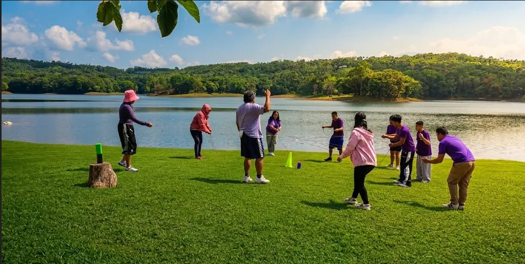 Corporate team building group photo by the lake