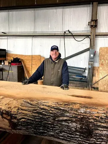 Photo of premium wood slabs from Riverside Logging and Sawmill, showcasing a range of high-quality options for various projects. The image highlights the exceptional quality and craftsmanship offered by RLS.