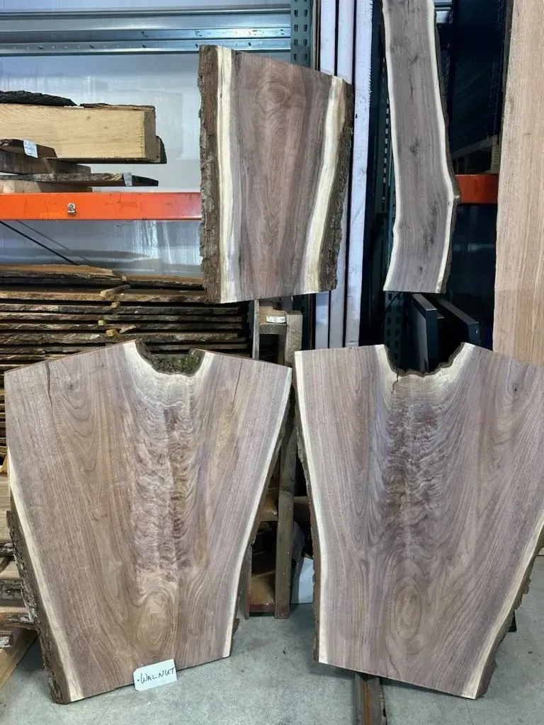 Close-up of walnut wood from Riverside Logging and Sawmill, showcasing its dark, rich color, smooth texture, and distinctive grain patterns, commonly used in high-quality furniture, cabinetry, and woodworking projects.