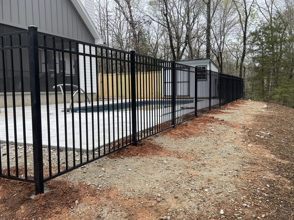 A tall green building with lots of windows
