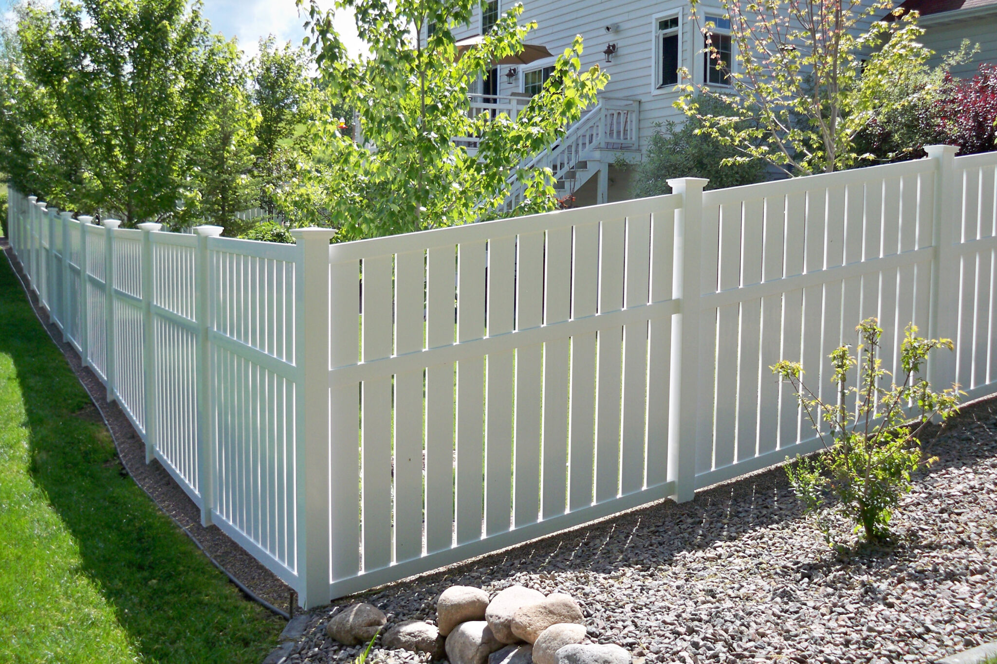 snow coated brown wooden fence