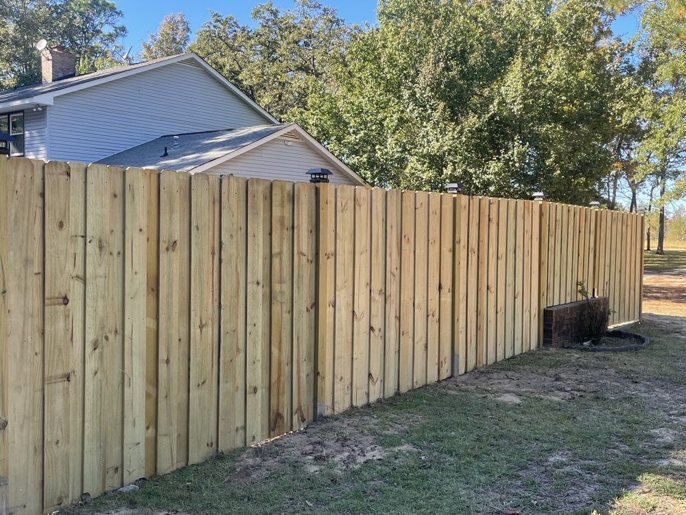 white and yellow wooden fence