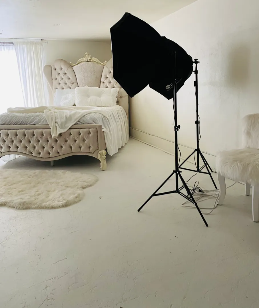 Photography studio amenities including accent chairs and holiday decor