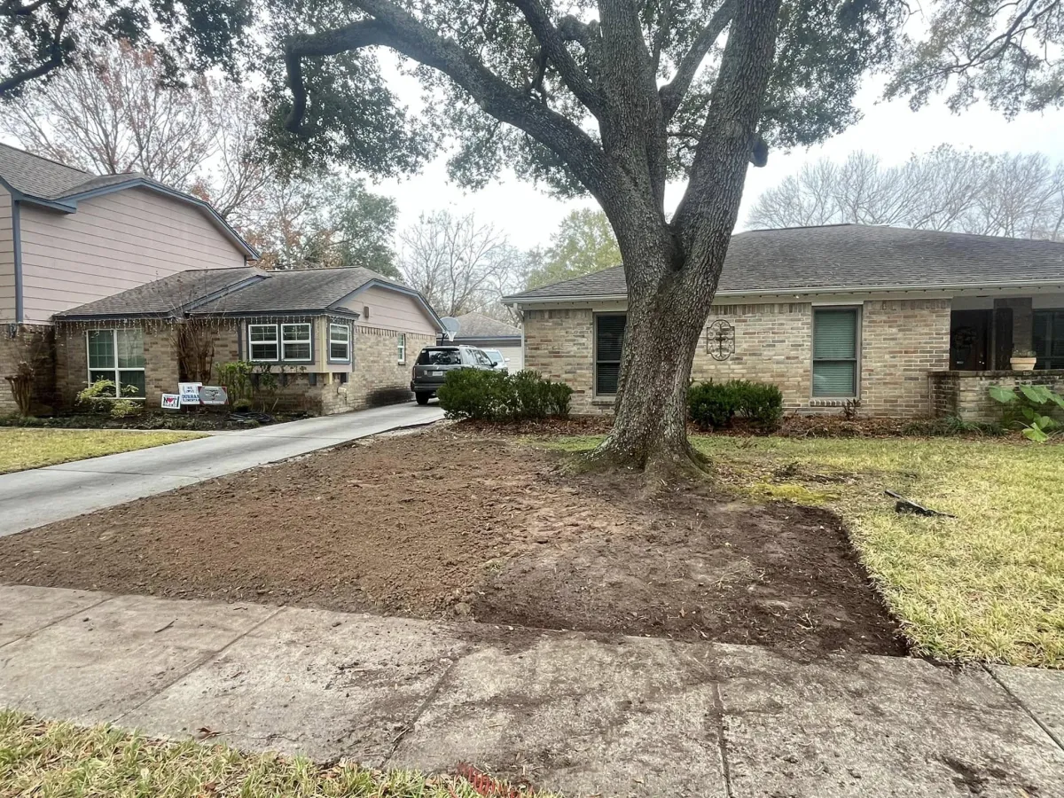 Landscaping in progress—freshly tilled soil area in a Houston front yard