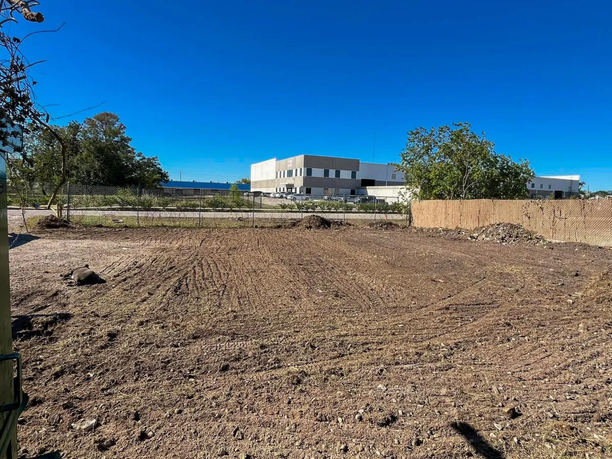 Freshly graded vacant lot after brush and debris clearing and land leveling by Facundo Trees in Houston, TX