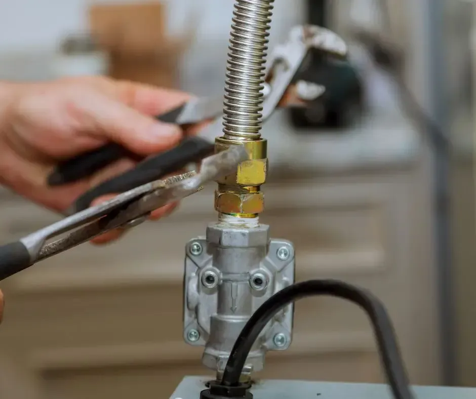 A plumber fixing a gas line.