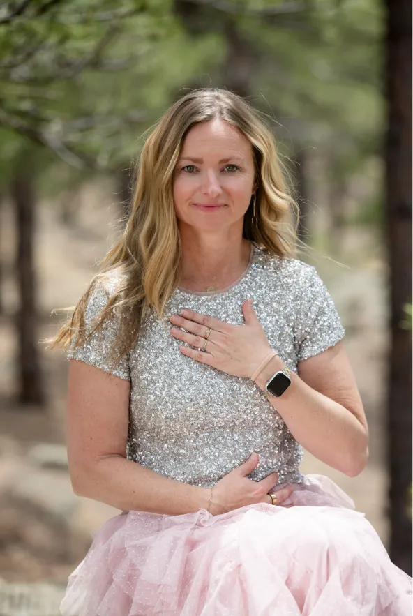 Portrait of Melissa Bauknight — natural light, at ease, looking directly at camera