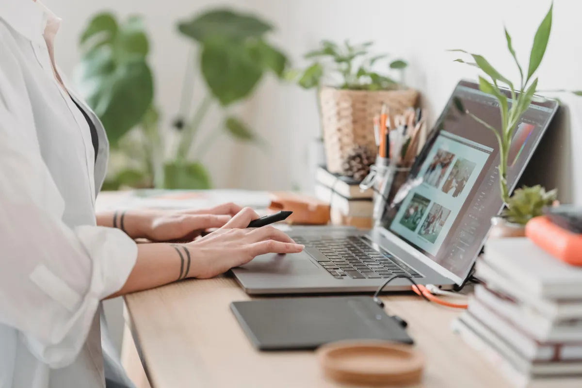 Woman working on laptop at desk