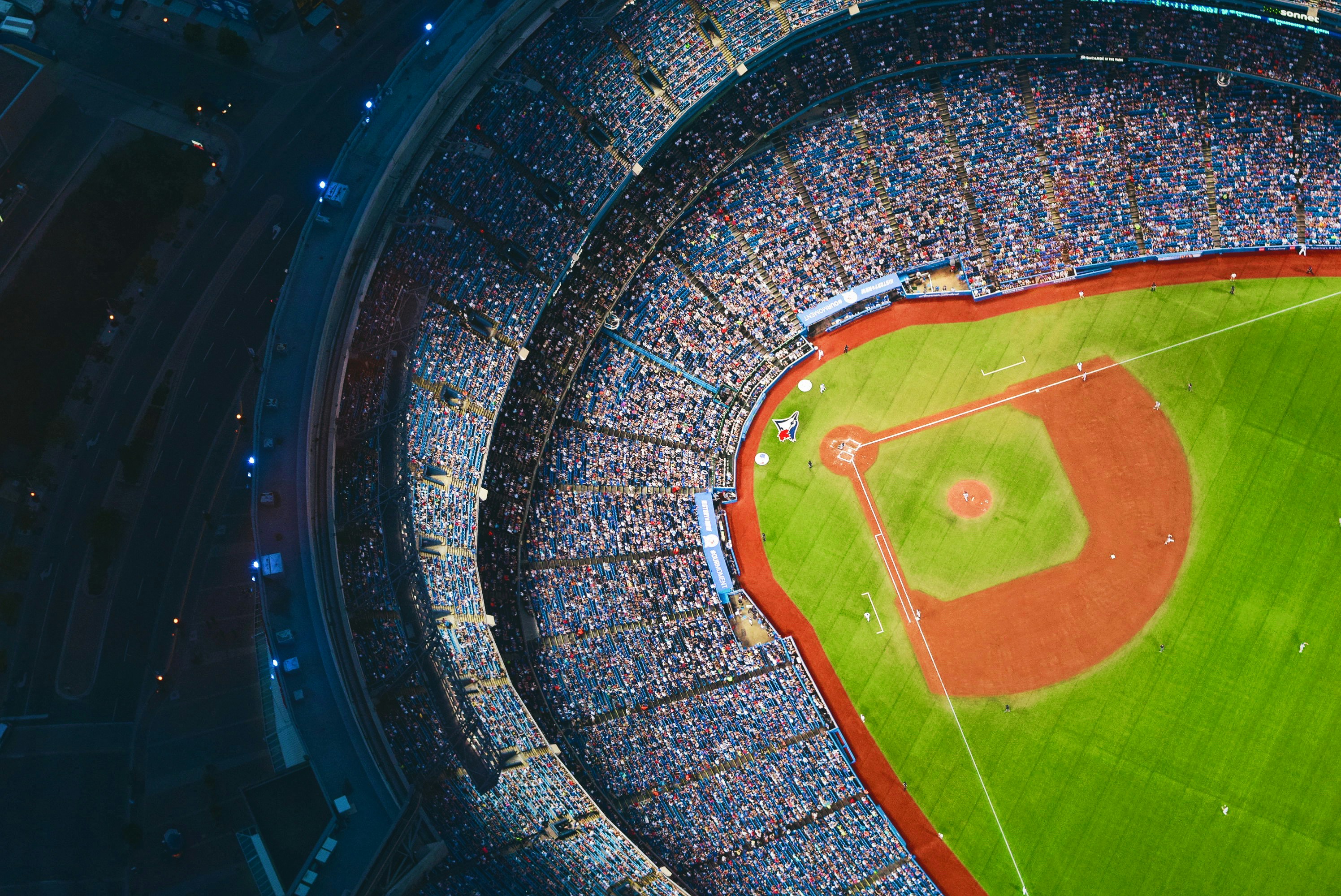 Packed sports stadium with bright lights