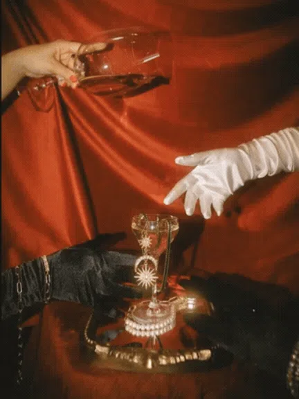 Signature red cocktail in a crystal glass on a dark marble bar