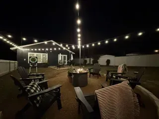 Outdoor gathering area with firepit and string lights at Ten33 in Abilene, Texas