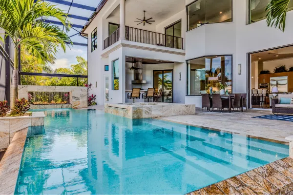 waterfall pool with outdoor kitchen