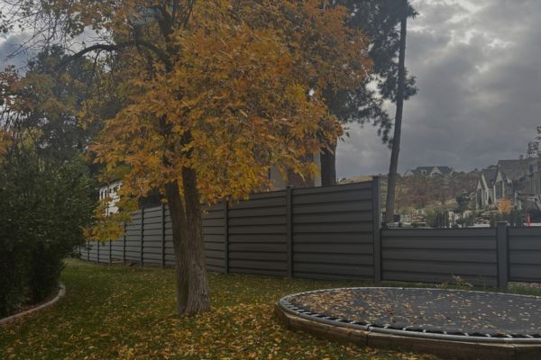 Residential yard prepared for Trex ence installation in Utah