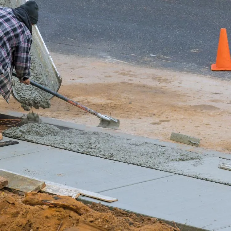 Large concrete foundation being poured