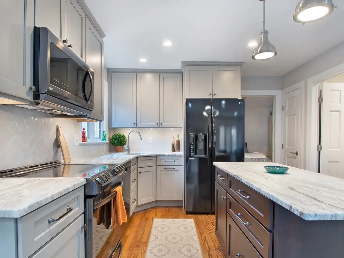 Beautifully renovated bathroom in Landenberg PA features marble countertops, spacious walk-in shower, and freestanding tub.