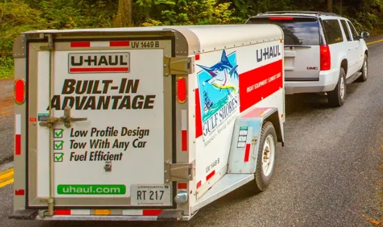 U-Haul trailers including enclosed cargo trailer and open utility trailer