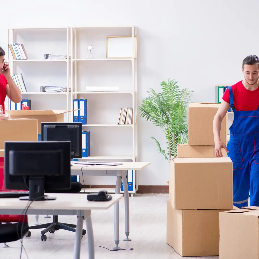 IT Relocation - person moving boxes of IT equipment