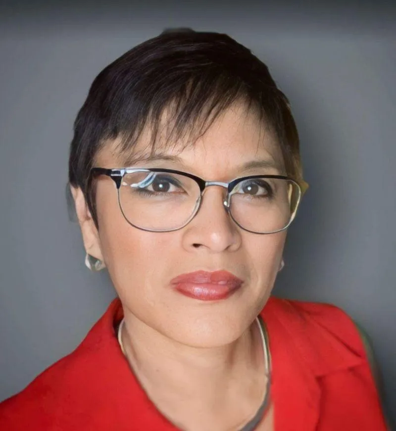 macbook pro beside black iphone 5 on brown wooden table