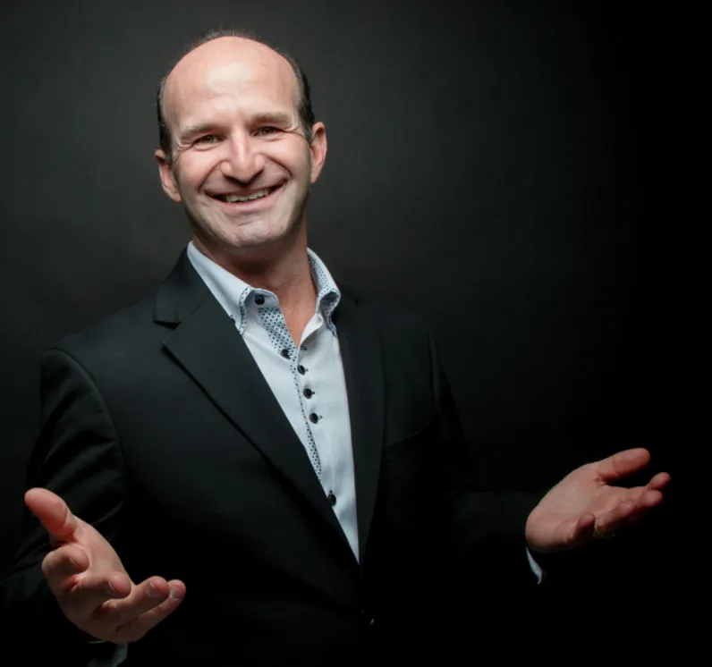 macbook pro beside black iphone 5 on brown wooden table