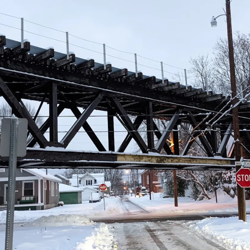 snowy bridge over a neighborhood street in belpre oh