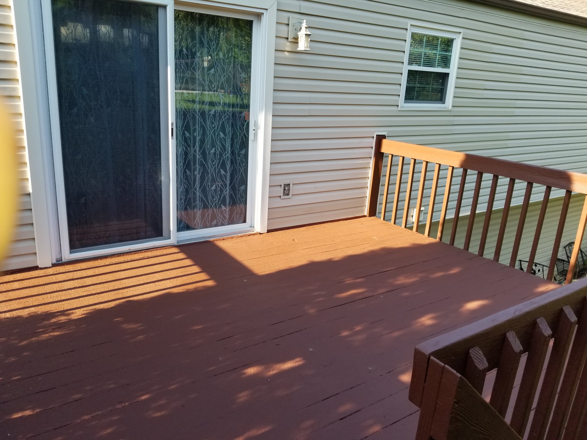 Restored wooden deck with new stain