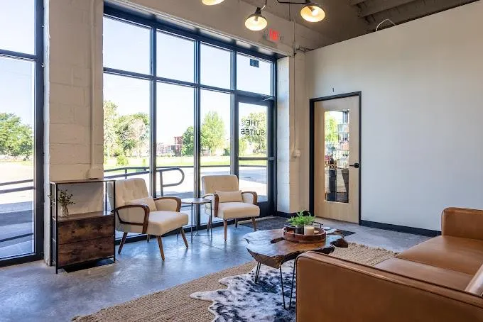 person holding amber glass bottle