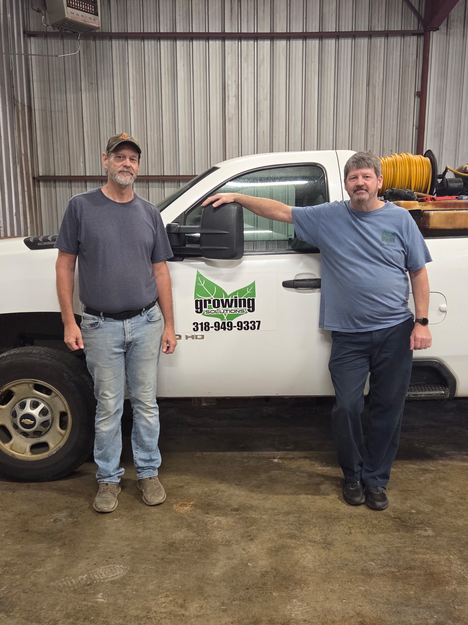 Local lawn care crew working on a healthy Louisiana yard