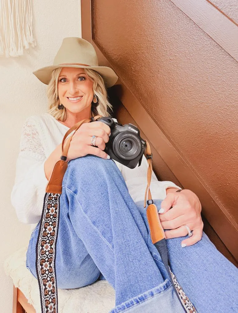 Warm neutral toned business photography of a small business owner in a studio