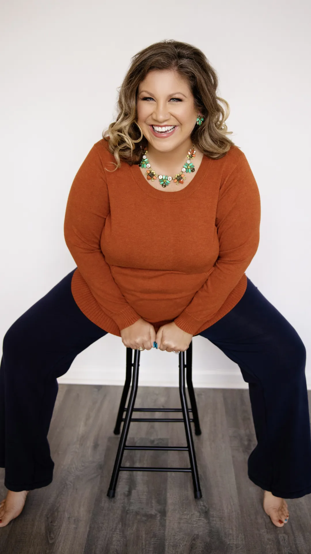 picture of Stacy on a stool laughing