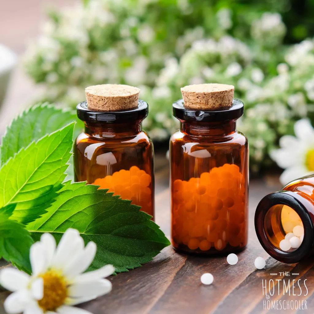 homeopathy bottles with flowers