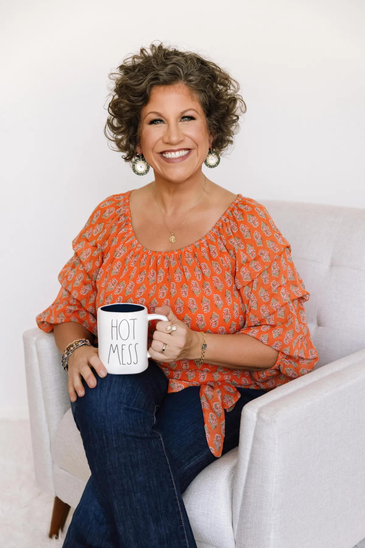 picture of Stacy on a stool laughing