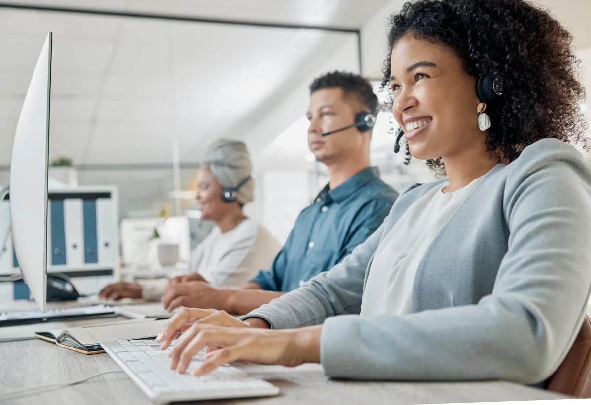 Three call center employees interacting with the clients over a call