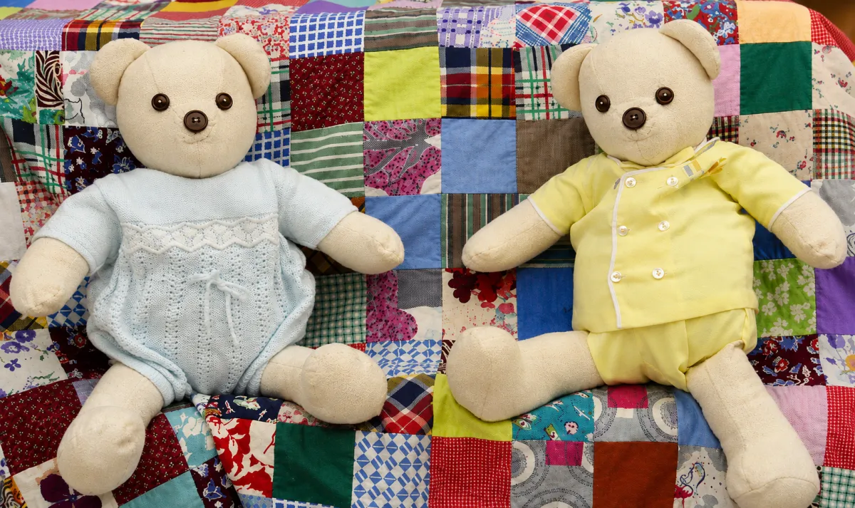 A handmade Memory Bear crafted from a collection of cherished baby clothes, demonstrating a smaller keepsake alternative.