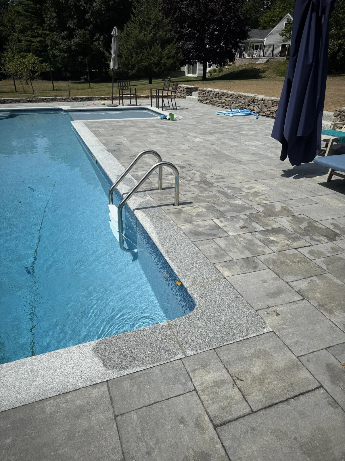 Modern backyard environment showing masonry and water integration