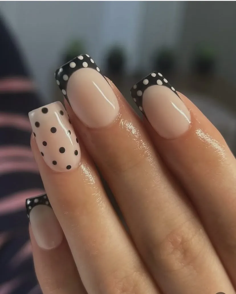 Black French tips and black-and-white polka-dot nail art, by Beauty by Amy